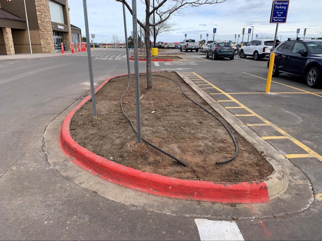 parking lot median about to receive commercial landscape renovation in broomfield