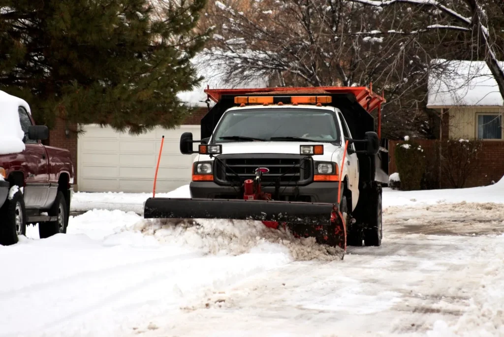 truck with attached snow plow for commercial snow removal services 